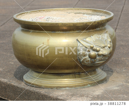 Antique incense burner on terrazzo floors. Antique incense burner on terrazzo floors. 38811278