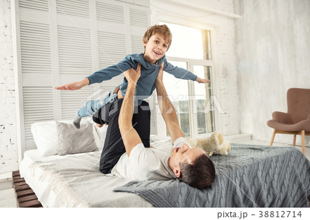 Joyful son and daddy playing together 38812714