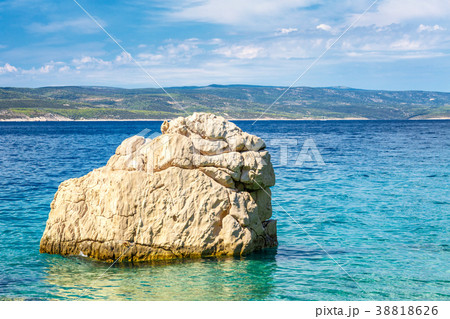 Rock in the sea at the beach in Baska Voda Rock in the sea at the beach in Baska Voda 38818626