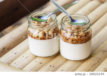 Glass jars with delicious yogurt 38820294