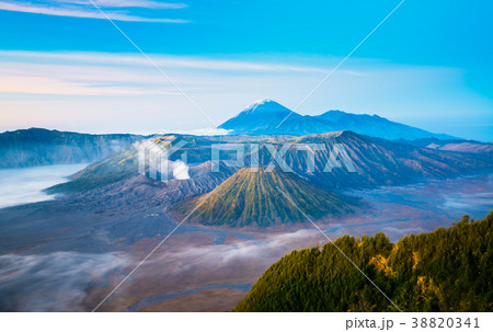 Mount Bromo during sunrise with flowing fog Mount Bromo during sunrise with flowing fog 38820341