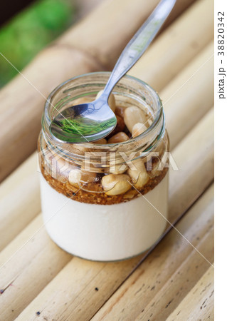 Glass jar with delicious yogurt Glass jar with delicious yogurt 38820342