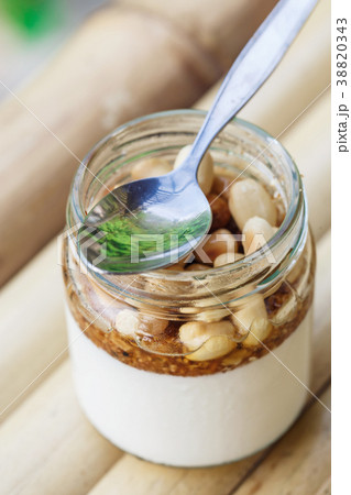 Glass jar with delicious yogurt 38820343