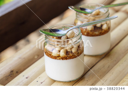Glass jars with delicious yogurt 38820344