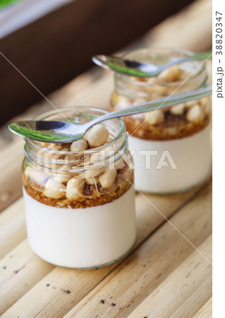 Glass jars with delicious yogurt Glass jars with delicious yogurt 38820347