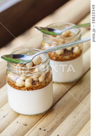 Glass jars with delicious yogurt Glass jars with delicious yogurt 38820349