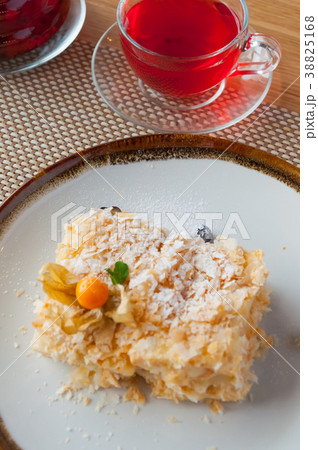 Napoleon cake on a white plate with berries with Napoleon cake on a white plate with berries with 38825168