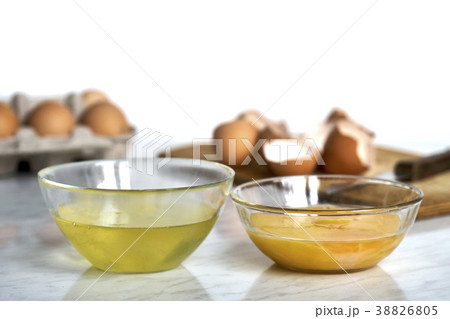 Transparent bowls with egg proteins and yolks 38826805