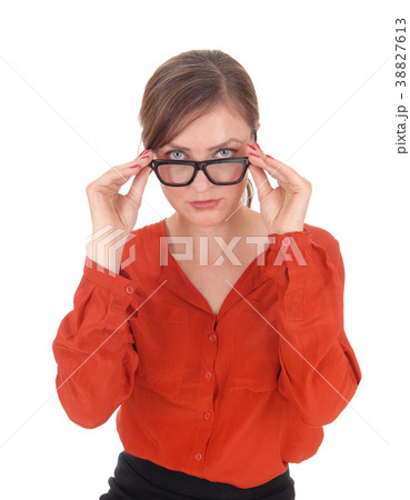 Woman looking over her glasses 38827613