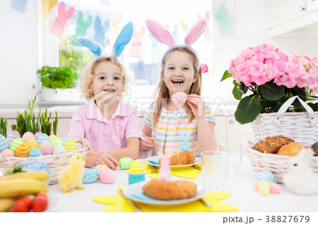 Easter egg hunt. Kids with bunny ears and basket. Easter egg hunt. Kids with bunny ears and basket. 38827679