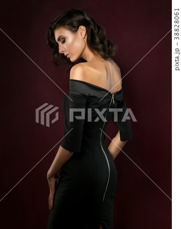 Young beautiful woman wearing black evening dress 38828061