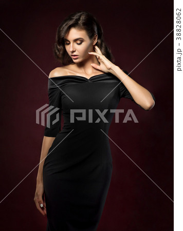 Young beautiful woman wearing black evening dress 38828062