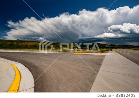 Empty open highway and stormy clouds in Wyoming 38832405