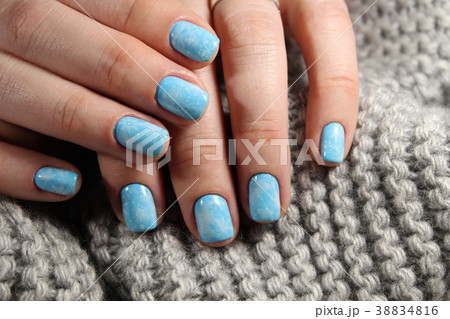 Christmas design manicure with snowflakes. Christmas design manicure with snowflakes. 38834816