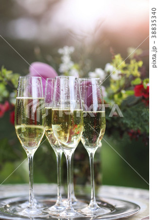 Champagne glasses on silver tray 38835340