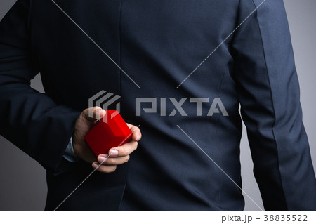Business man hand holding red gift box 38835522