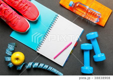 Notepad, a bottle of water, an apple, a skipping Notepad, a bottle of water, an apple, a skipping 38838908