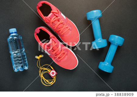 Top view of sportswear, dumbbells and digital 38838909