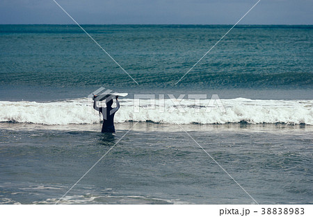 woman surfer with surfboard ready for surfing 38838983