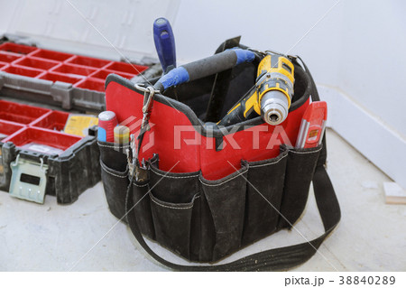 set of tools in a bag on wooden background set of tools in a bag on wooden background 38840289