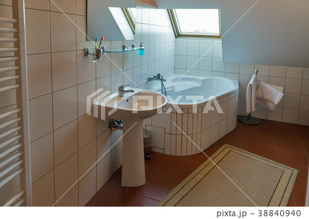 Modern bathroom with bath, washbasin and window. Modern bathroom with bath, washbasin and window. 38840940