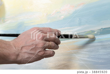 An artist painting in studio An artist painting in studio 38845920