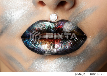 Close up view of woman lips with fashion makeup Close up view of woman lips with fashion makeup 38846079