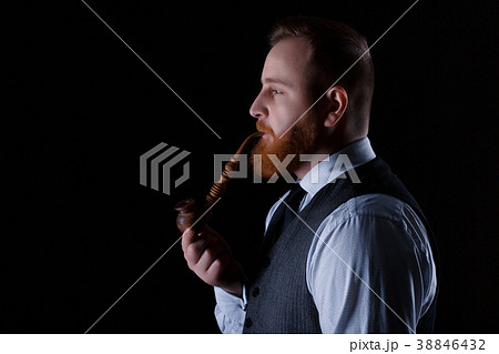 man smoking a pipe 38846432