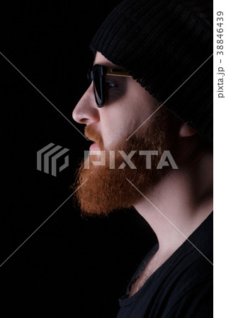 bearded man in sunglasses and hat 38846439