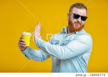red beard man holding cup with coffee 38846774
