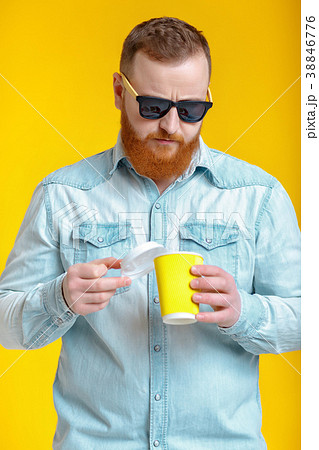 red beard man holding cup with coffee 38846776