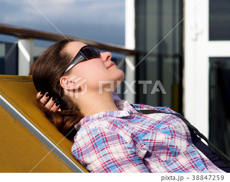 woman resting on the lounger woman resting on the lounger 38847259