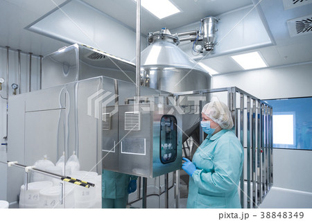 Pharmaceutical factory woman worker in protective 38848349