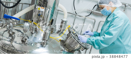 Pharmaceutical factory woman worker in protective 38848477