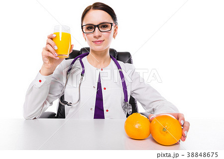 Female nutritionist sitting in her working place Female nutritionist sitting in her working place 38848675
