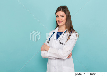 Attractive female doctor in white coat Attractive female doctor in white coat 38849009