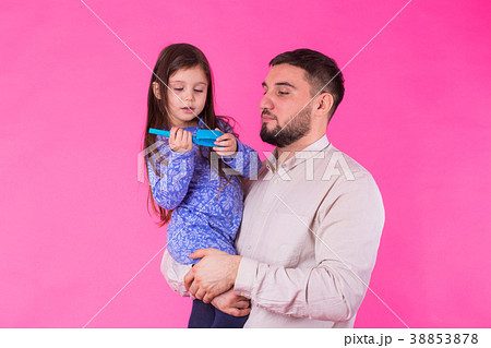 Happy father holding baby daughter in hands over 38853878