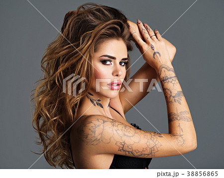 Beautiful sexy girl with a tattoo on the body - Stock Photo [38856865] -  PIXTA