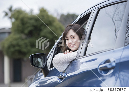車の助手席の若い女性の写真素材