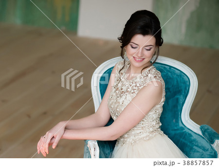 Half length portrait of brunette smiling woman Half length portrait of brunette smiling woman 38857857