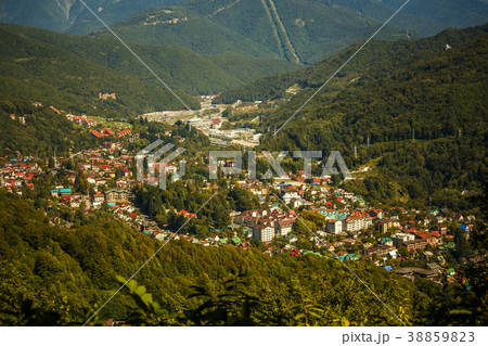 Photo of buildings at foot of mountains 38859823