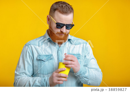 red beard man holding cup with coffee 38859827