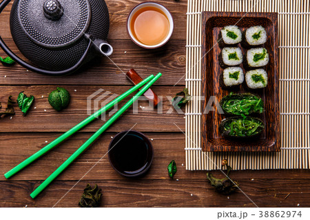 Wooden surface with rolls, teapot Wooden surface with rolls, teapot 38862974