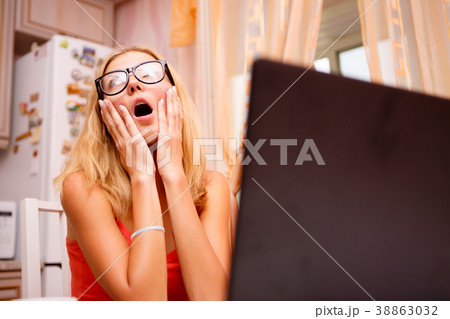 Young woman strongly frustrated sitting in front 38863032