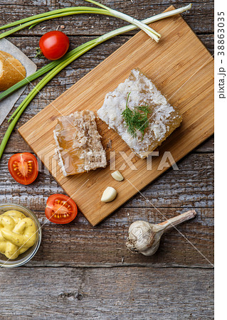 Homemade jelly meat with mustard, bread, tomatoes Homemade jelly meat with mustard, bread, tomatoes 38863035