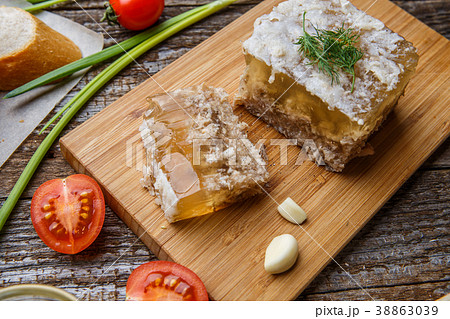 Homemade jelly meat with mustard, bread, tomatoes Homemade jelly meat with mustard, bread, tomatoes 38863039