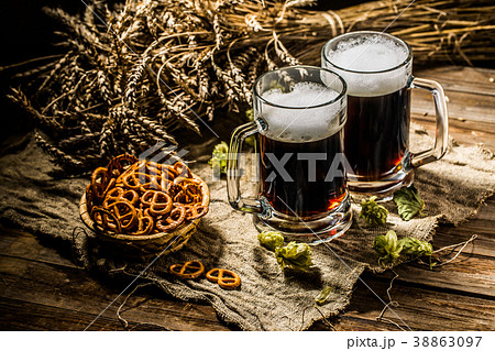 Two tankard beer with wheat and hops , basket of 38863097