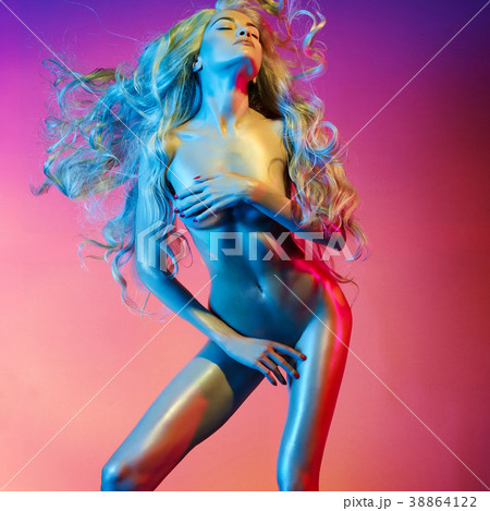 Nude sexy blonde in colorful light. Nude sexy blonde in colorful light. 38864122