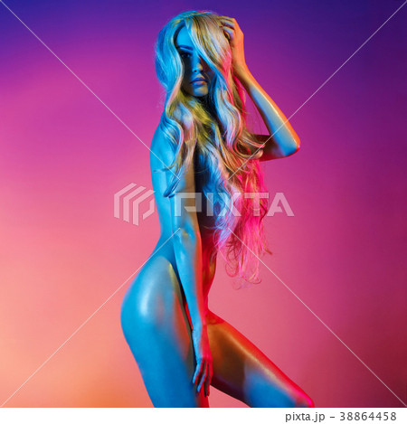 Nude sexy blonde in colorful light. Nude sexy blonde in colorful light. 38864458