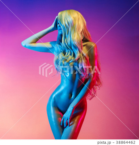 Nude sexy blonde in colorful light. 38864462
